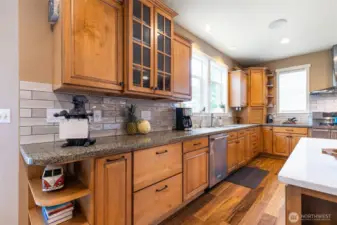 Beautiful tile backsplash accents the quartz counters.