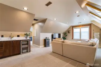 Upstairs bonus room with wet bar. Door leads to office/flex room or could be a bedroom.