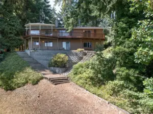The view of the property from the lake shows easy access for daily walks to the water.