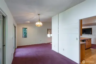 The dining area off the kitchen fits a table for 10. There is access to the main deck from here.