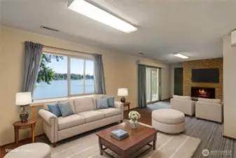Downstairs features a daylight basement with a functioning wood burning fireplace. There is potential to turn this into a separate living space as well.