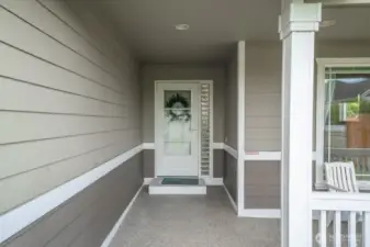 Welcoming front entry, with quality screen door that allows you to let the breeze in or shut the cold out.