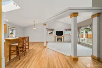 Hardwood laminates frame in the cozy living room with gas fire place.