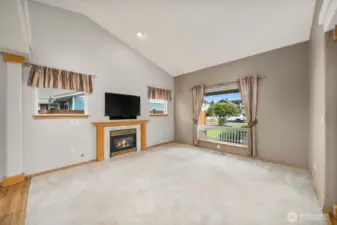 Sit next to the cozy gas fireplace and enjoy your view out the large picture window.