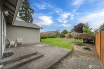 The spacious patio off the kitchen is perfect for entertaining or relaxing with your favorite beverage