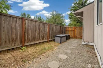 A roomy dog run space wraps around the rear of the home.