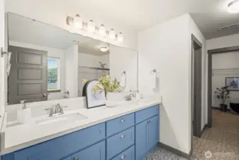 Your luxurious primary bathroom with double vanity, private toliet, walk in shower, and deep soaking tub
