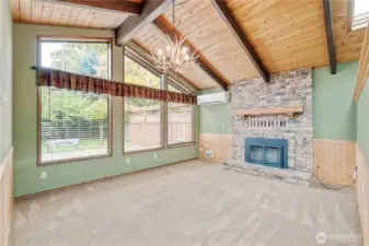 Family room with vaulted ceilings and electric fireplace
