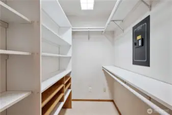 Primary walk in closet with wall safe