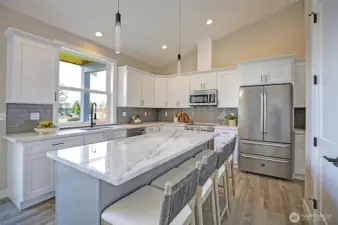 Chef’s kitchen featuring premium Bertazzoni appliances and sleek modern finishes