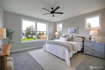 Large primary bedroom with abundant natural light
