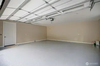 Large two car garage with epoxy floor. Lots of storage in attic space.