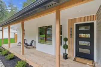 The covered front porch is the perfect place to enjoy morning coffee, evening refreshments, or just listen to a winter storm.