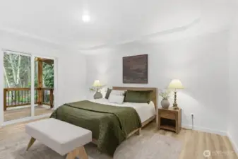 The primary bedroom also has a slider to the covered back deck.