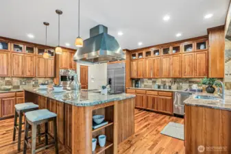 Abundant Cabinetry Featuring Display Windows and Shelves!