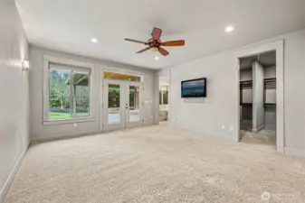 Wall Sconce, Overhead, & Ceiling Fan Light Coupled with a Wall of Windows Providing Natural Light!