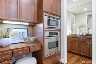 Planning desk is a handy feature. Also notice the extra lighting and peek into the bulter's bar to the dining room.