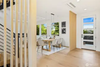 A seamless transition leads into the expansive, light-filled open-concept living area.