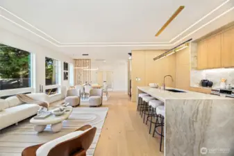 Kitchen view showcasing premium integrated appliances and high-end quartz countertops.