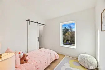 Well-appointed guest bedroom showcasing consistent high-end finishes.