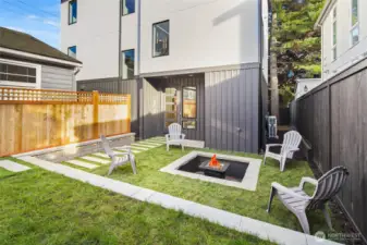 Professionally landscaped yard with a custom patio area, perfect for alfresco dining.