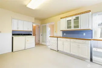 A glass door gives the dining room privacy for a formal dinner...follow the other door to the hallway, more storage and the bedrooms.
