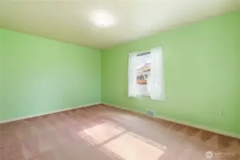 The larger bedroom is at the end of the hall...