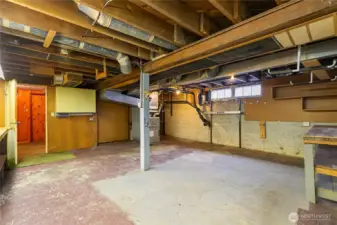 On the left is a workbench...great for storage, a shop or?