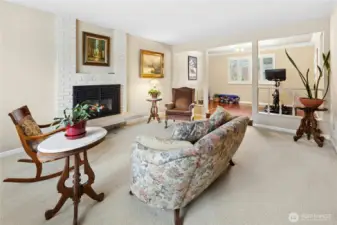 Spacious living room with cozy fireplace.