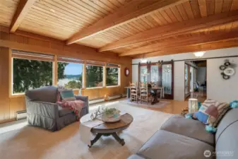 Living room with views of bay. Gliding antique doors