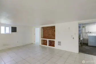 Large flex room in basement is fully finished. Could be fixed up to be a home office, man cave, storage area, play room. Low ceilings.