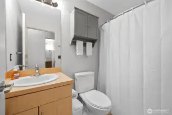 Full bath with tub/shower combo.