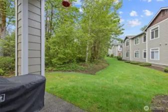 This home is nestled amongst lush greenery and mature landscaping.