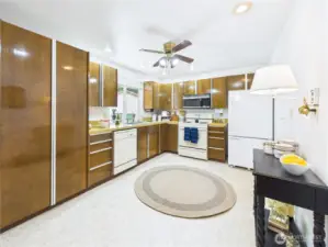 The kitchen is spacious and could have room for a rolling island if you so desired.