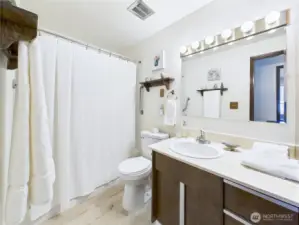 The second bathroom is conveniently located in the middle of the house. Your guests will have their own bathroom to do the grooming.