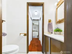Cute half bath with access from the third bedroom and the dining room makes this floorplan very versatile.