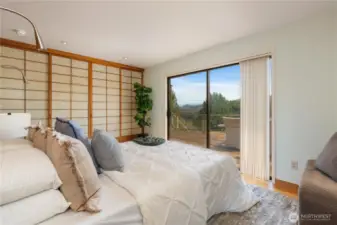 Primary bedroom with another set of sliding doors to the amazing deck