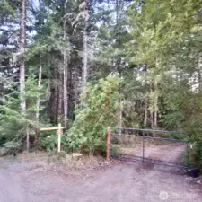 Gated drive leads to interior of parcel