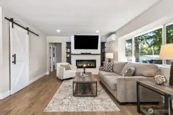 LVP flooring, electric fireplace, built-in shelving, mini-split systems for year 'round comfort, updated windows, barn doors, 6" molding - all the contemporary touches you'd want!