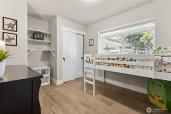 Main floor secondary bedroom - could work as an office space or playroom!