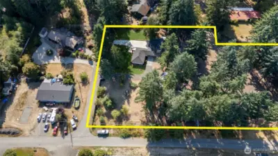 Almost 2-1/2 acres! Incudes sunny spaces and tree-drenched areas too.