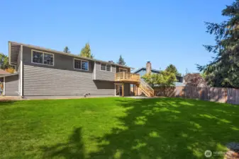 Large grassy backyard for all your needs.