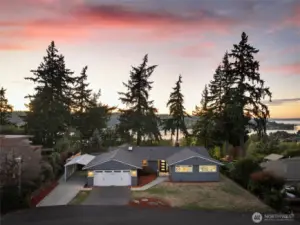 Sunset aerial view front of home
