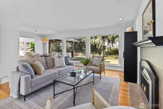 Front family room with gas burning fireplace and views!