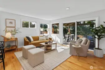 Secondary flex living space off the kitchen opens to covered entertaining patio