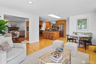 Secondary flex living space opens to dining area and eat-in kitchen with timeless design, stainless steel appliances, large island