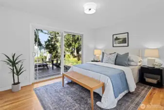 Primary bedroom at end of hallway. Trex deck right off primary with views!