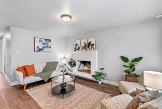 Living room with wood burning fireplace.