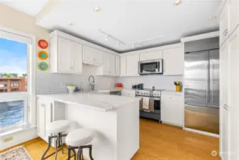 Beautifully remodeled kitchen with marble countertops and all new appliances.