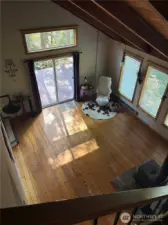 Living room empty from top of stairs